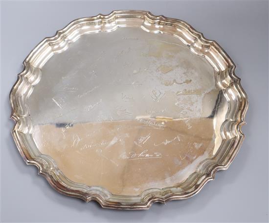 A large silver shaped circular salver, engraved with signatures, Frank Hawker Ltd, Birmingham, 1957, 54 oz.